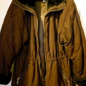 Brown parka w/ faux fur on collar and sleeves. Slightly worn. Good condition.